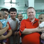 Bob Chris and Aaron with one boy each