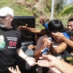 Randy handing out to people in need