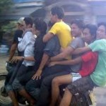 Three people are taking turns driving while the others text.