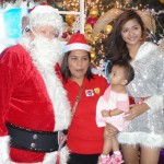 The baby has a close eye on Santa