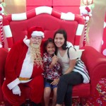 Santa posing with a couple cuties