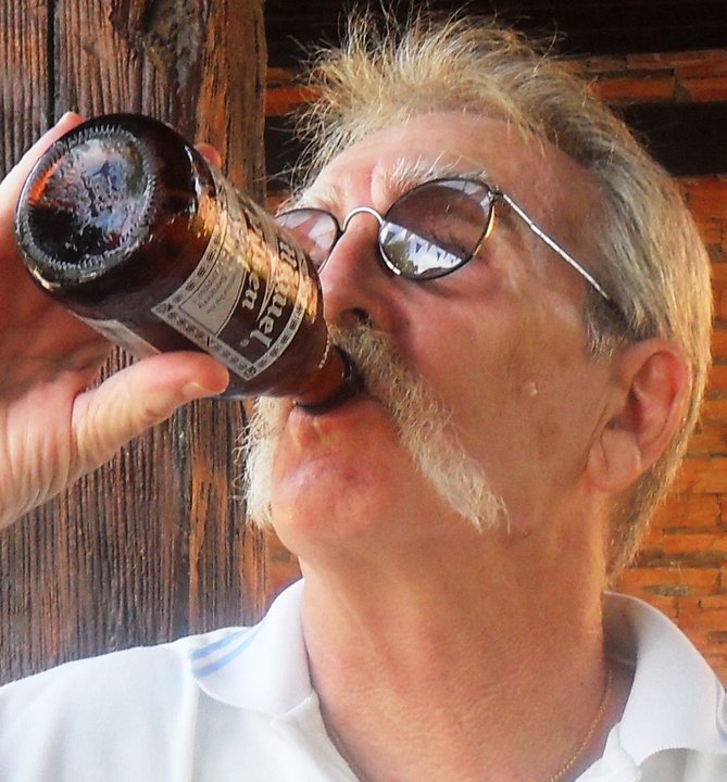 Paul Thompson - is he drinking beer or having computer trouble?